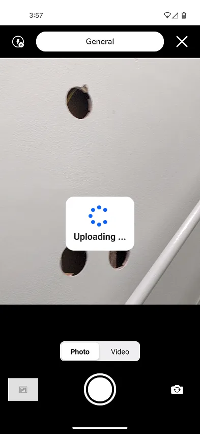 Pixly mobile camera screen with Uploading message and General category selected.